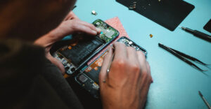 MAn repairing inside of iphone